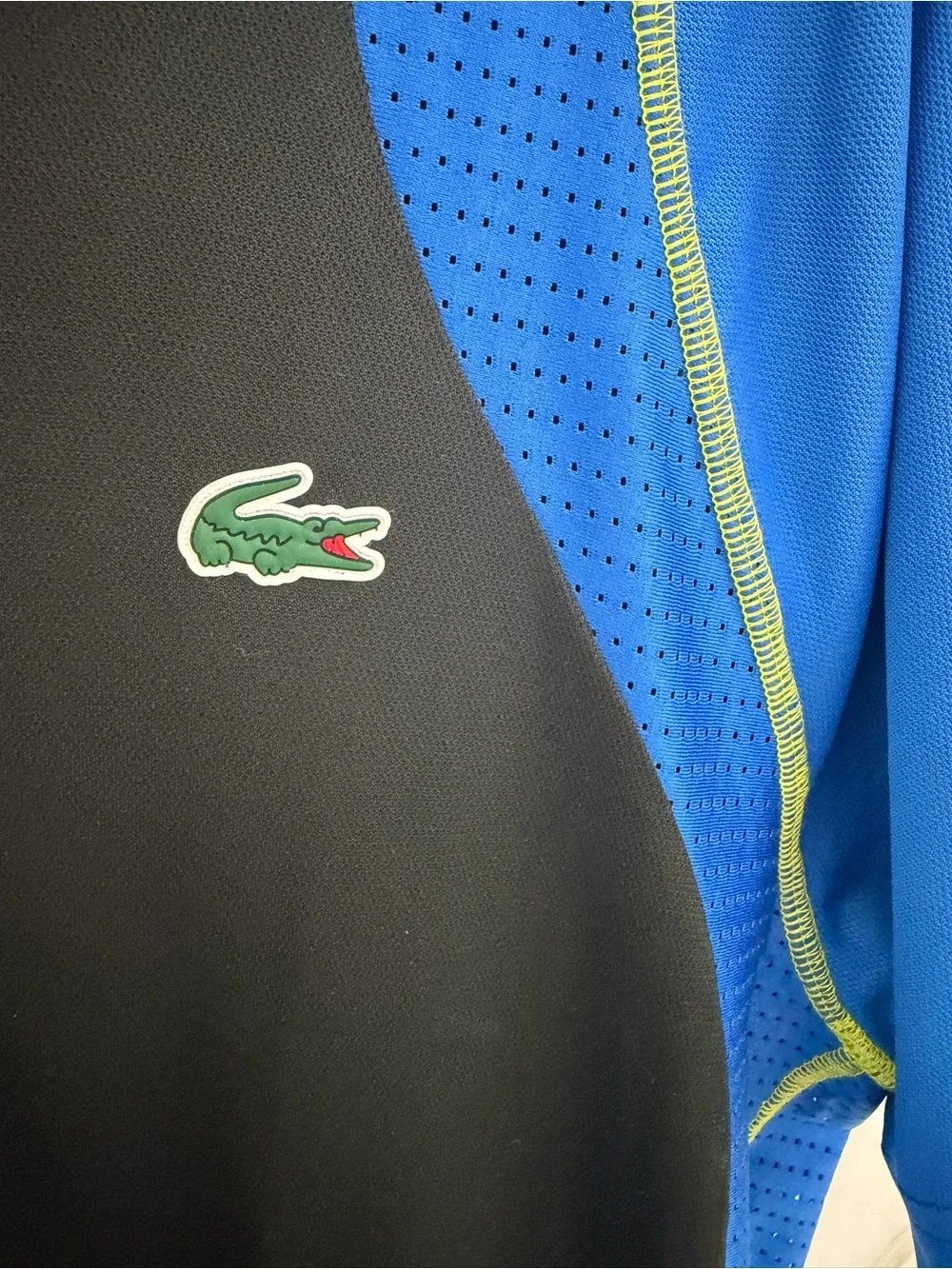 Lacoste Black Polo with Blue Panels and Green Accents